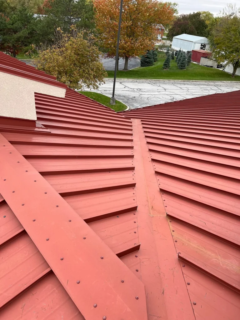 Nitro Roofing red metal roof repair in Wapakoneta, Ohio
